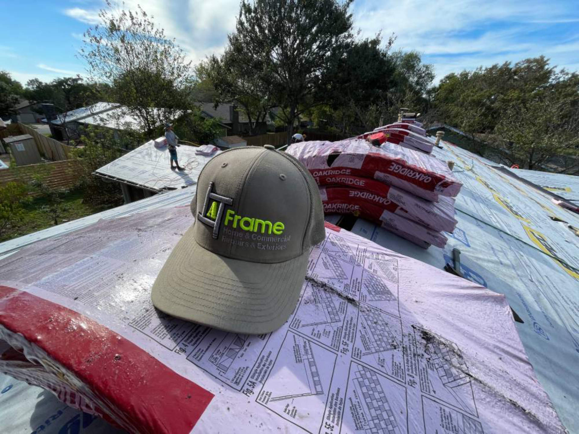 A Frame roofer repairing a residential roof