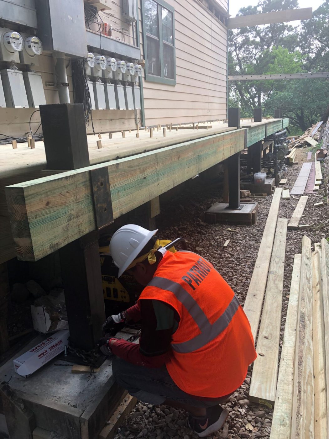 Structural beam rebuild under a multi-unit building