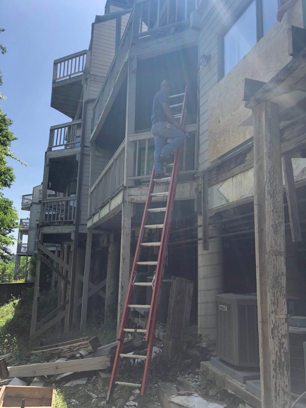 A Frame crew accessing upper balconies for repairs