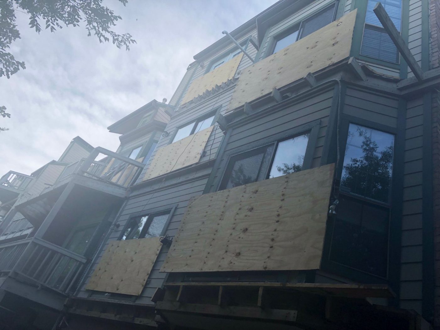 Exterior siding repair on a multi-unit building