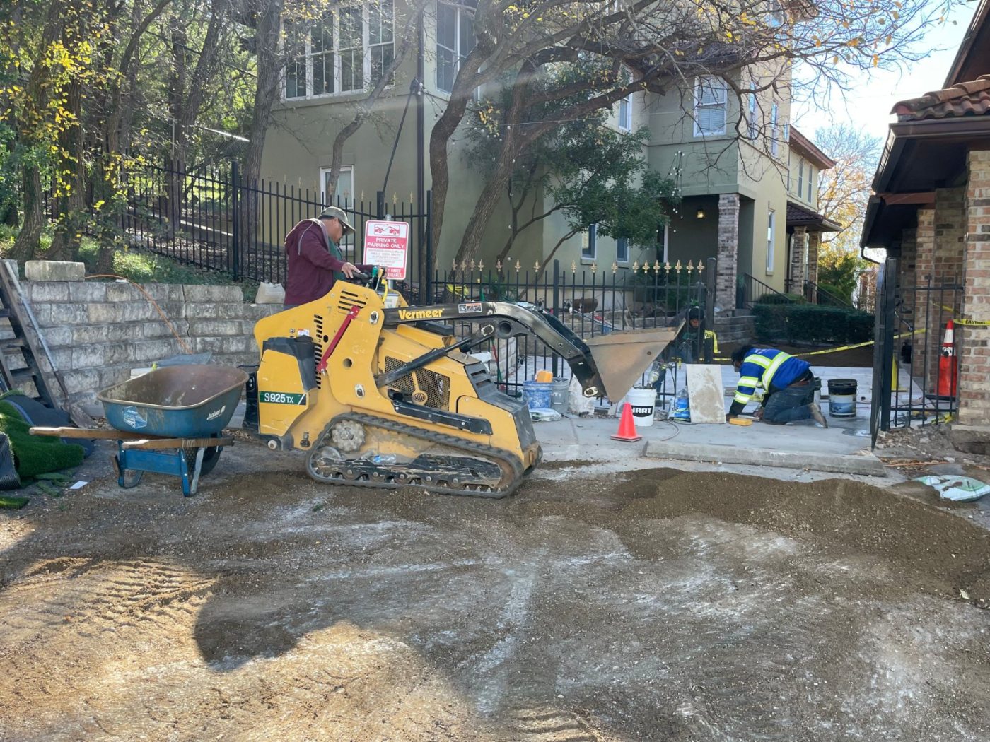 A Frame crew grading and prepping a site with a Vermeer skid loader