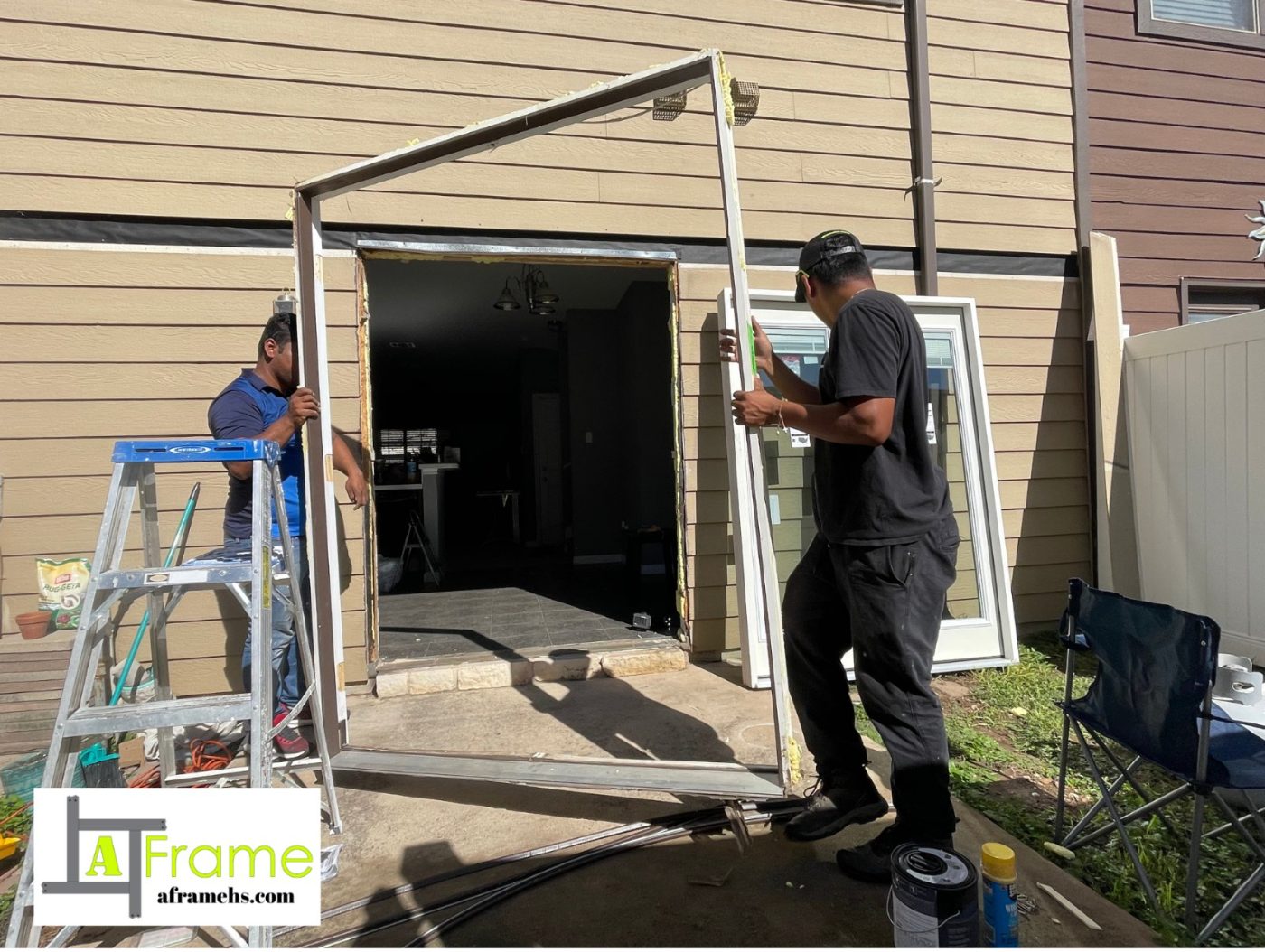 A Frame crew fitting a new patio door