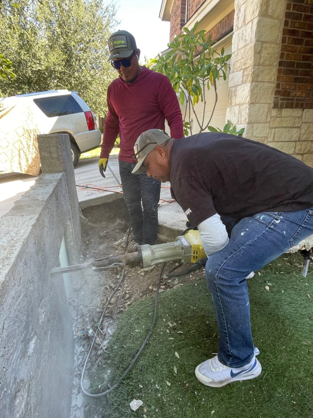 A Frame crew core-cutting concrete during a build