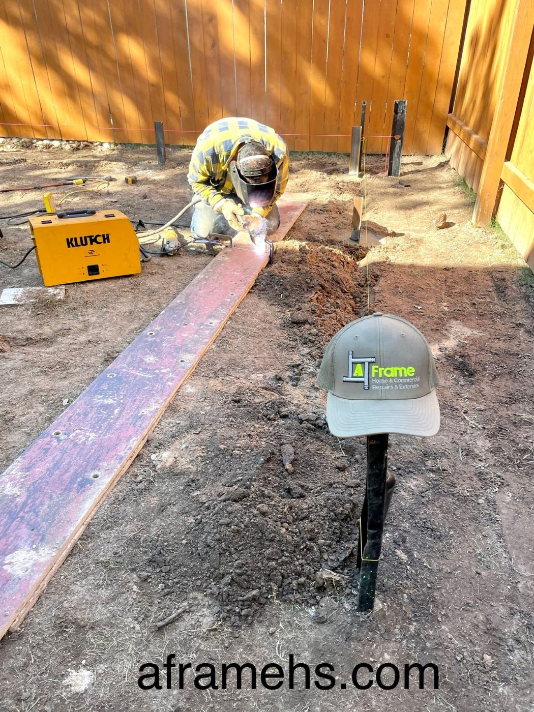 A Frame welder fabricating a steel support beam on site